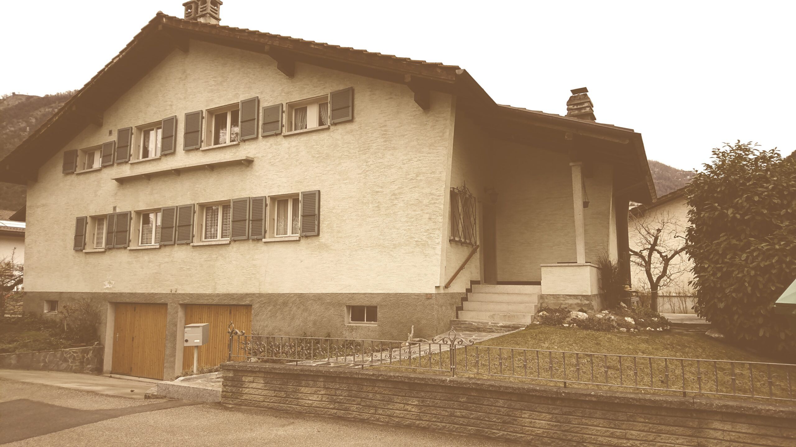a large white building with a fountain in front of it